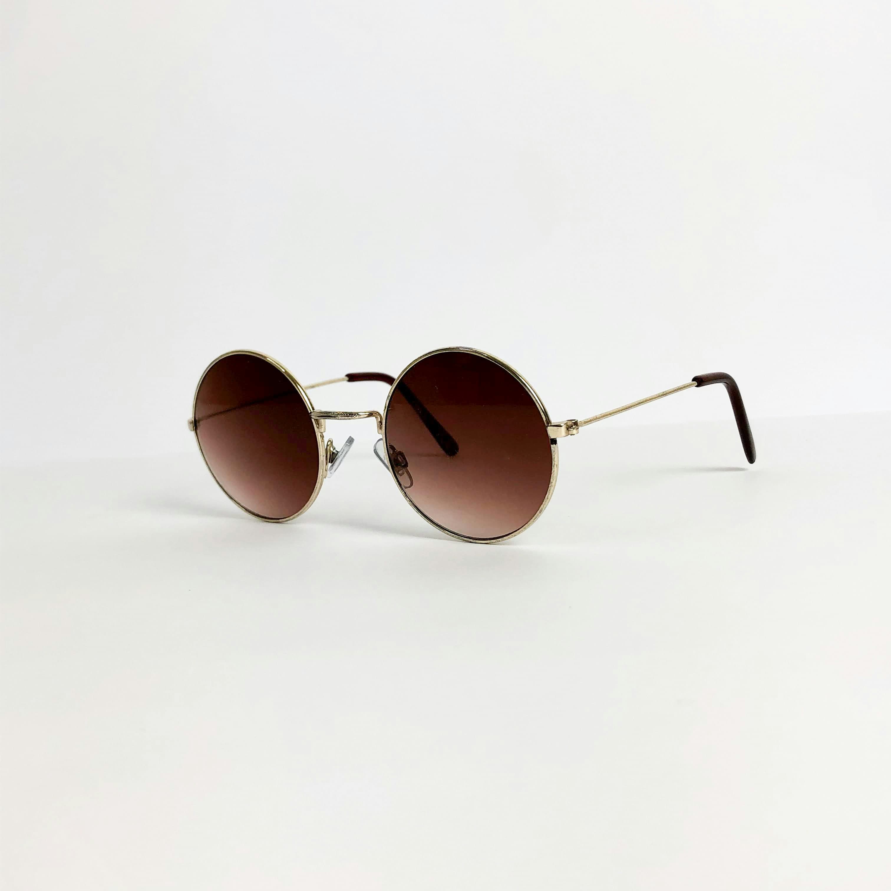 Round gold-frame sunglasses used in a competitor keyword gap example